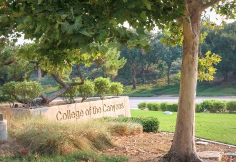 College of the Canyons sign surrounded by trees