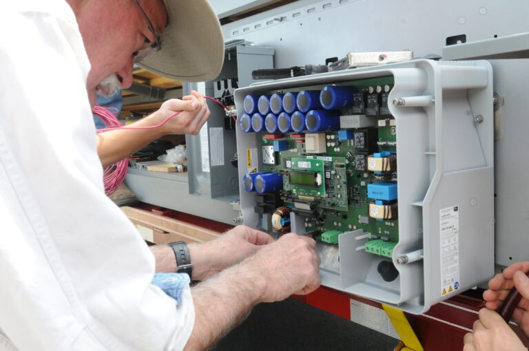 Student working on circuit panel during faculty training
