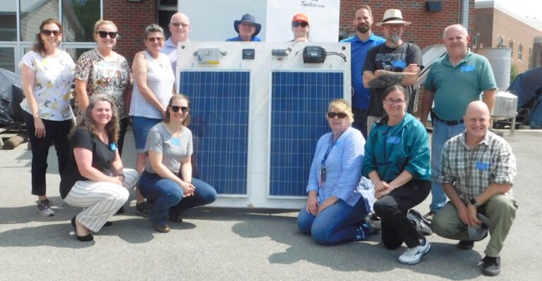 Faculty at Central Carolina Energy Workshop with Solar panel