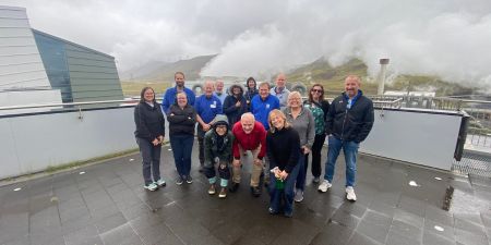 CREATE group photo at Hellisheidi geothermal power plant in Iceland.