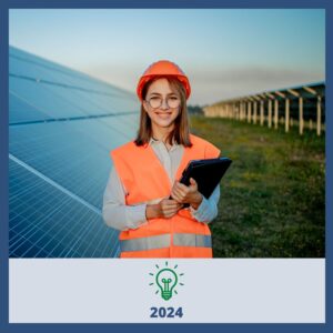 Female on solar field in vest and hardhat.